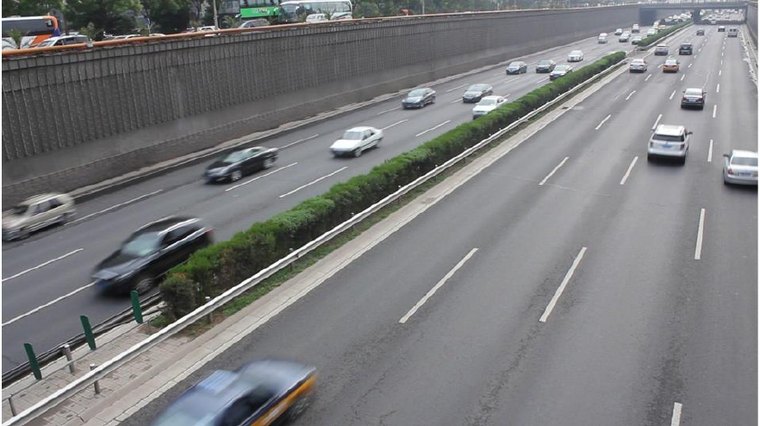 Multi-lane highway with cars travelling in both directions